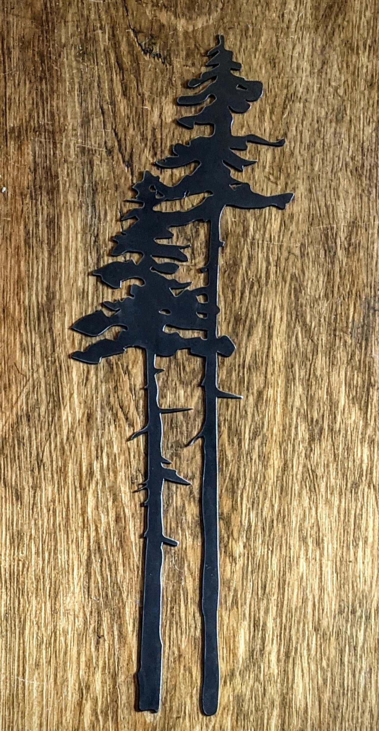 Two Tall Metal Evergreen Trees